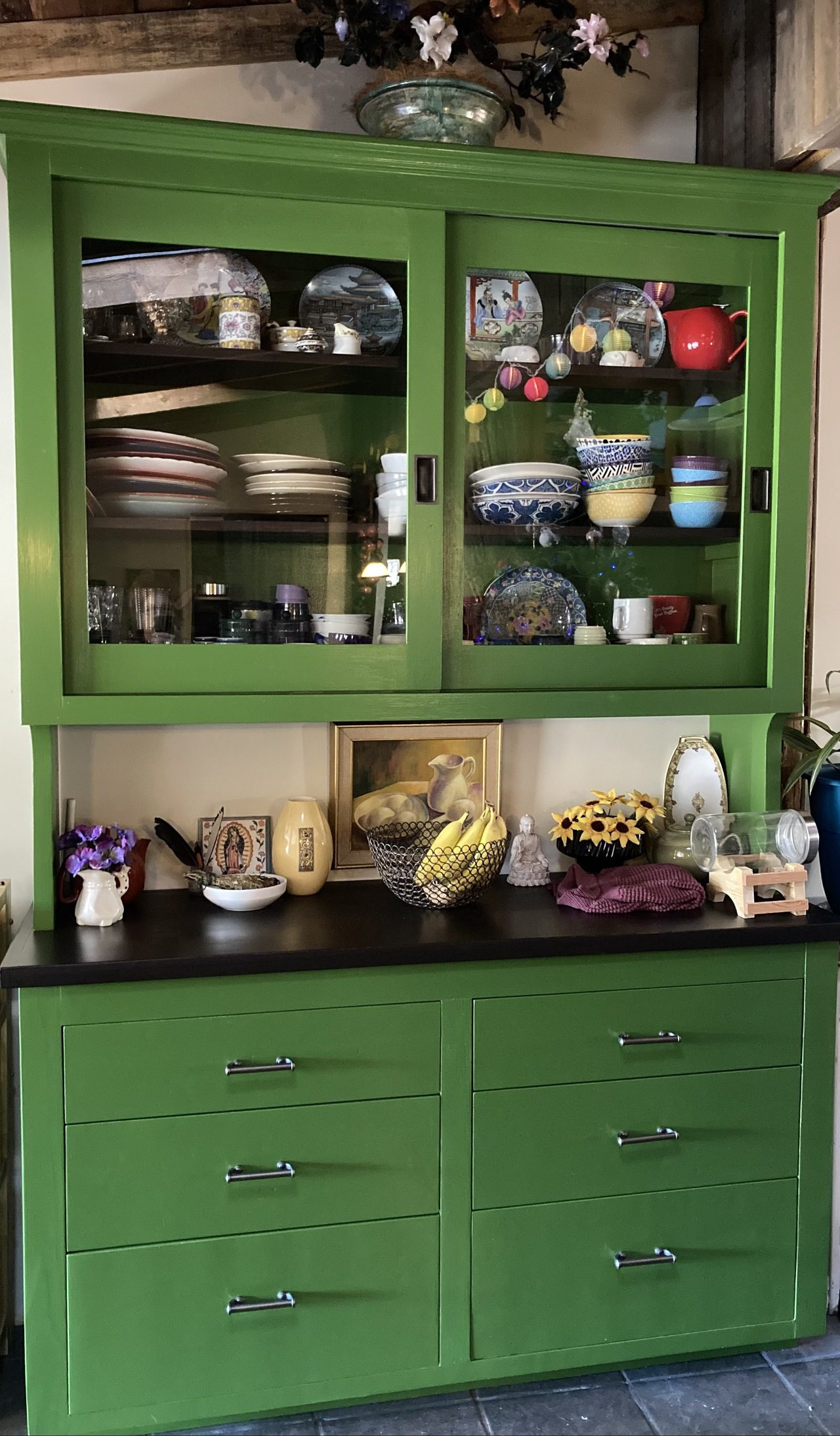 Green cabinet with glass doors
